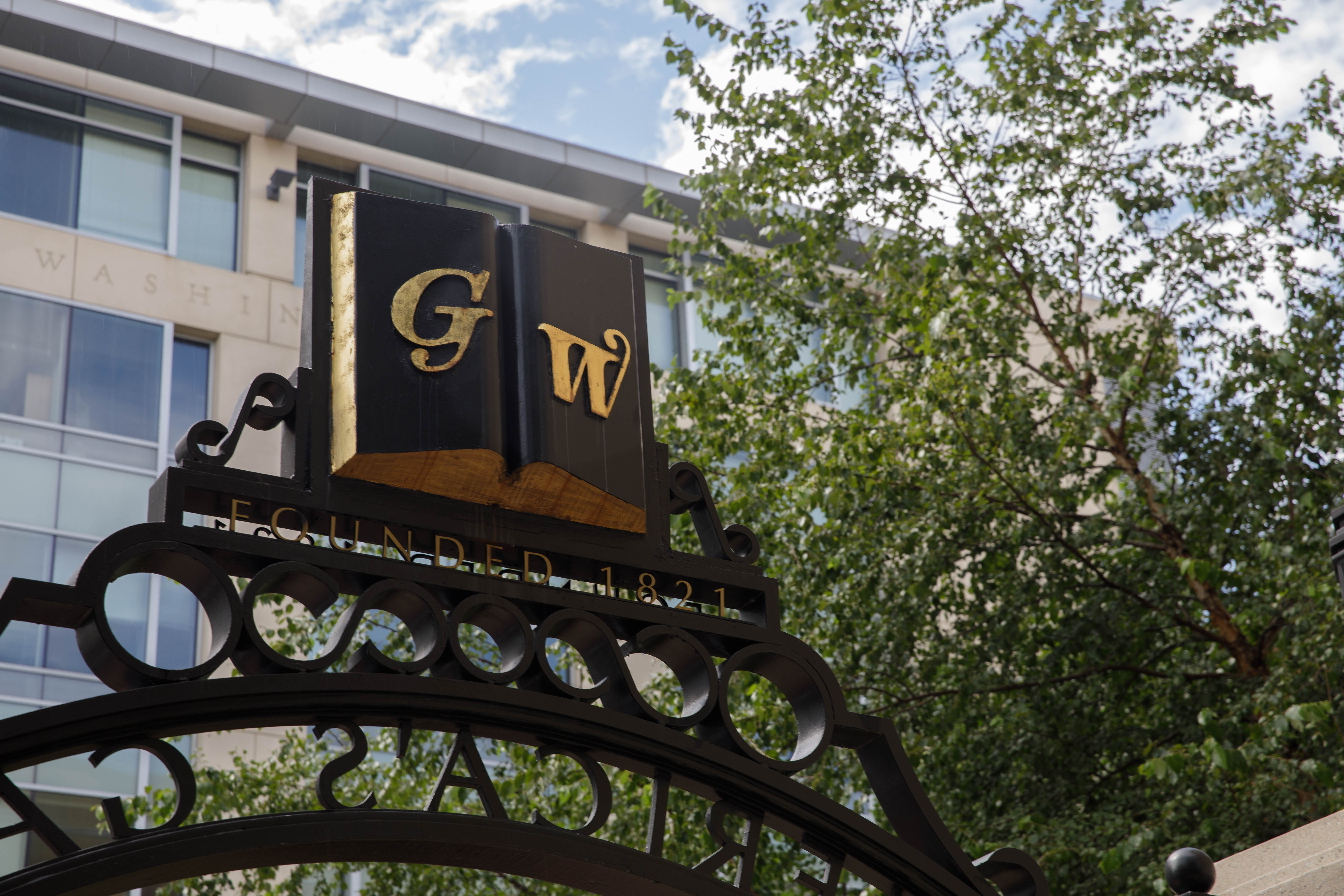 GW's Founders Gate with trees in the background