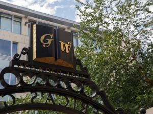 GW's Founders Gate with trees in the background