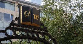 GW's Founders Gate with trees in the background
